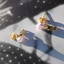 Load image into Gallery viewer, Violet Mini Lantern Earrings on book 
